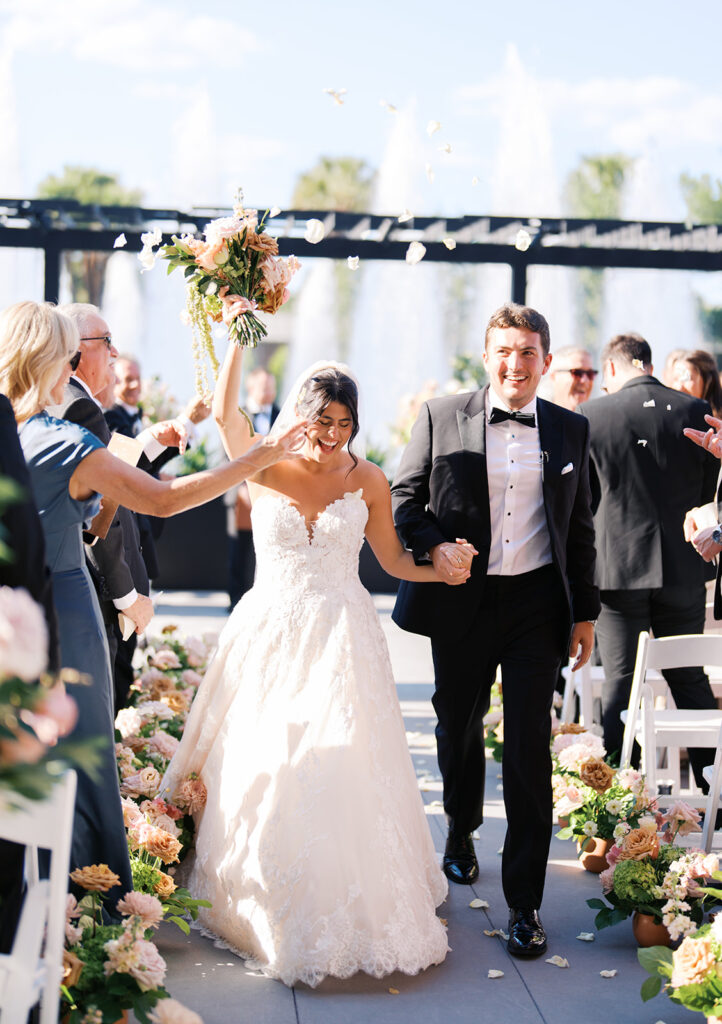 Bride and groom exchanging vows during an outdoor Horseshoe Bay Resort wedding ceremony with beautiful Texas waterfront views