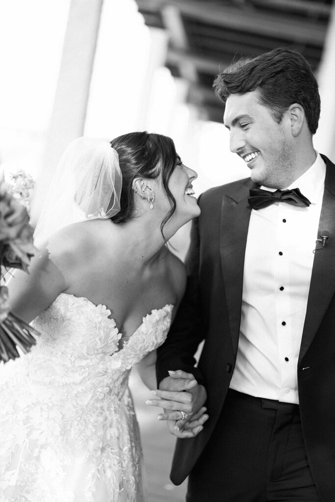 Bride and groom sharing romantic wedding portraits at Horseshoe Bay Resort surrounded by sunshine and stunning Lake LBJ scenery.