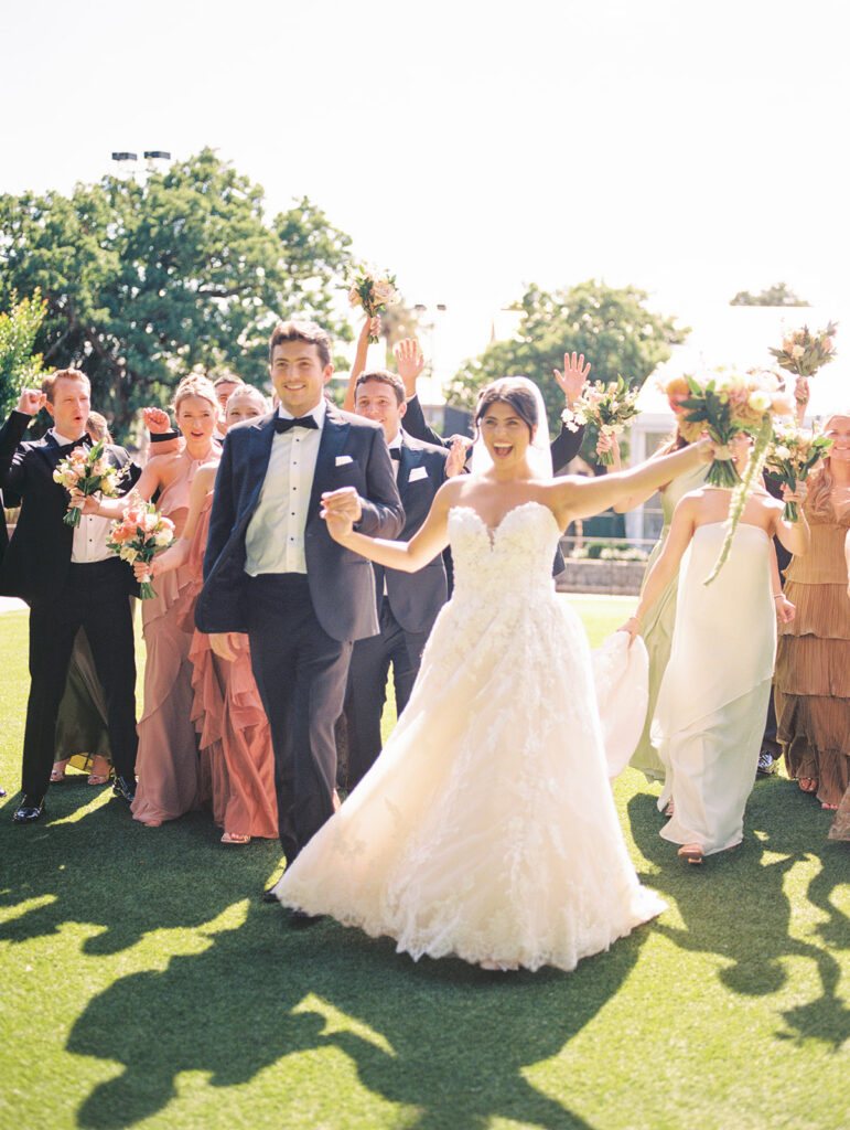 Bride and groom sharing romantic wedding portraits at Horseshoe Bay Resort surrounded by sunshine and stunning Lake LBJ scenery.