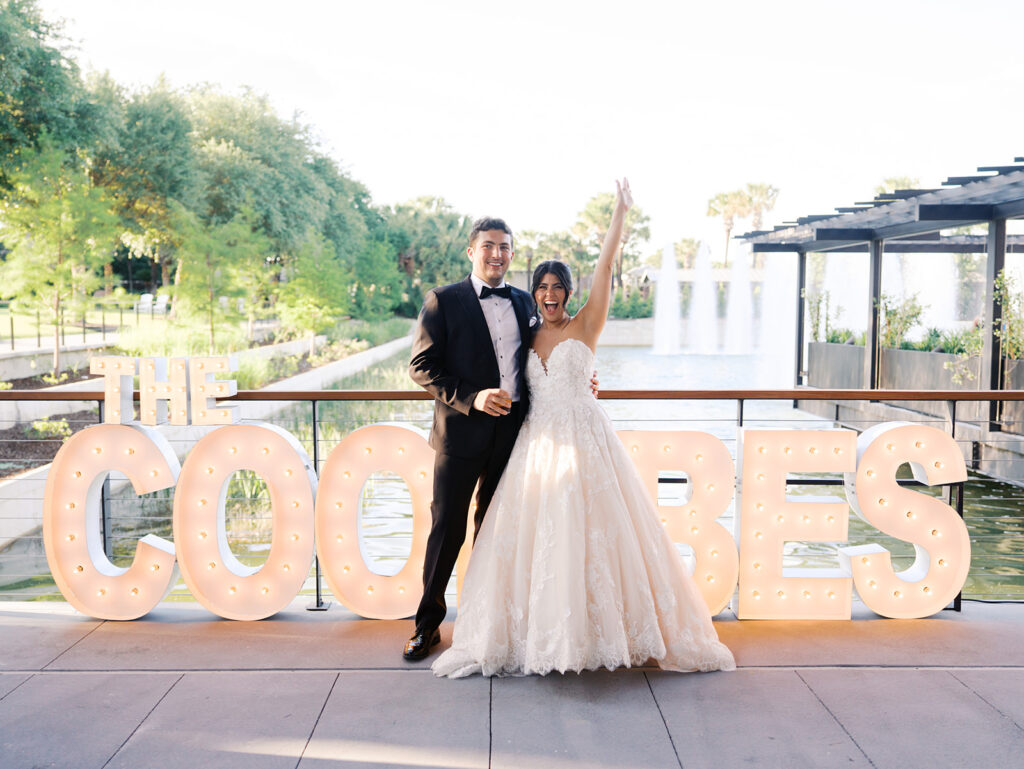 Bride and groom sharing romantic wedding portraits at Horseshoe Bay Resort surrounded by sunshine and stunning Lake LBJ scenery.