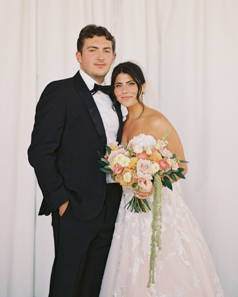 Bride and groom sharing romantic wedding portraits at Horseshoe Bay Resort surrounded by sunshine and stunning Lake LBJ scenery.