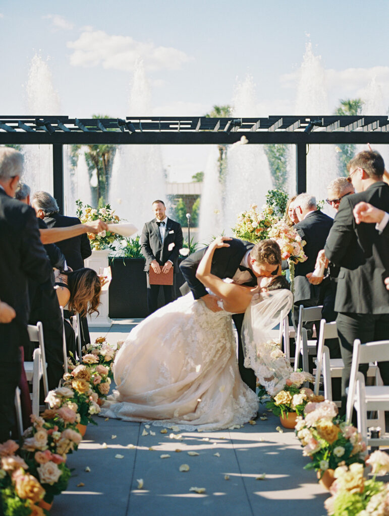 Bride and groom exchanging vows during an outdoor Horseshoe Bay Resort wedding ceremony with beautiful Texas waterfront views