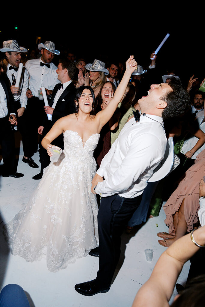 Guests celebrating during an elegant Horseshoe Bay Resort wedding reception filled with joyful dancing, heartfelt moments, and warm Texas hospitality