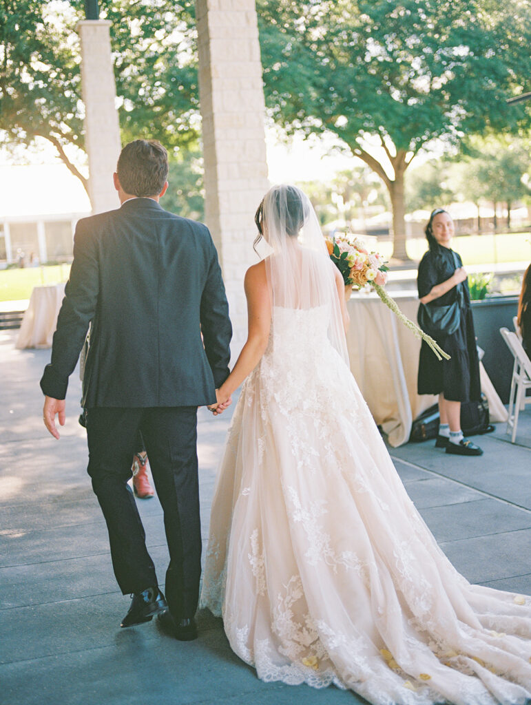 Bride and groom exchanging vows during an outdoor Horseshoe Bay Resort wedding ceremony with beautiful Texas waterfront views