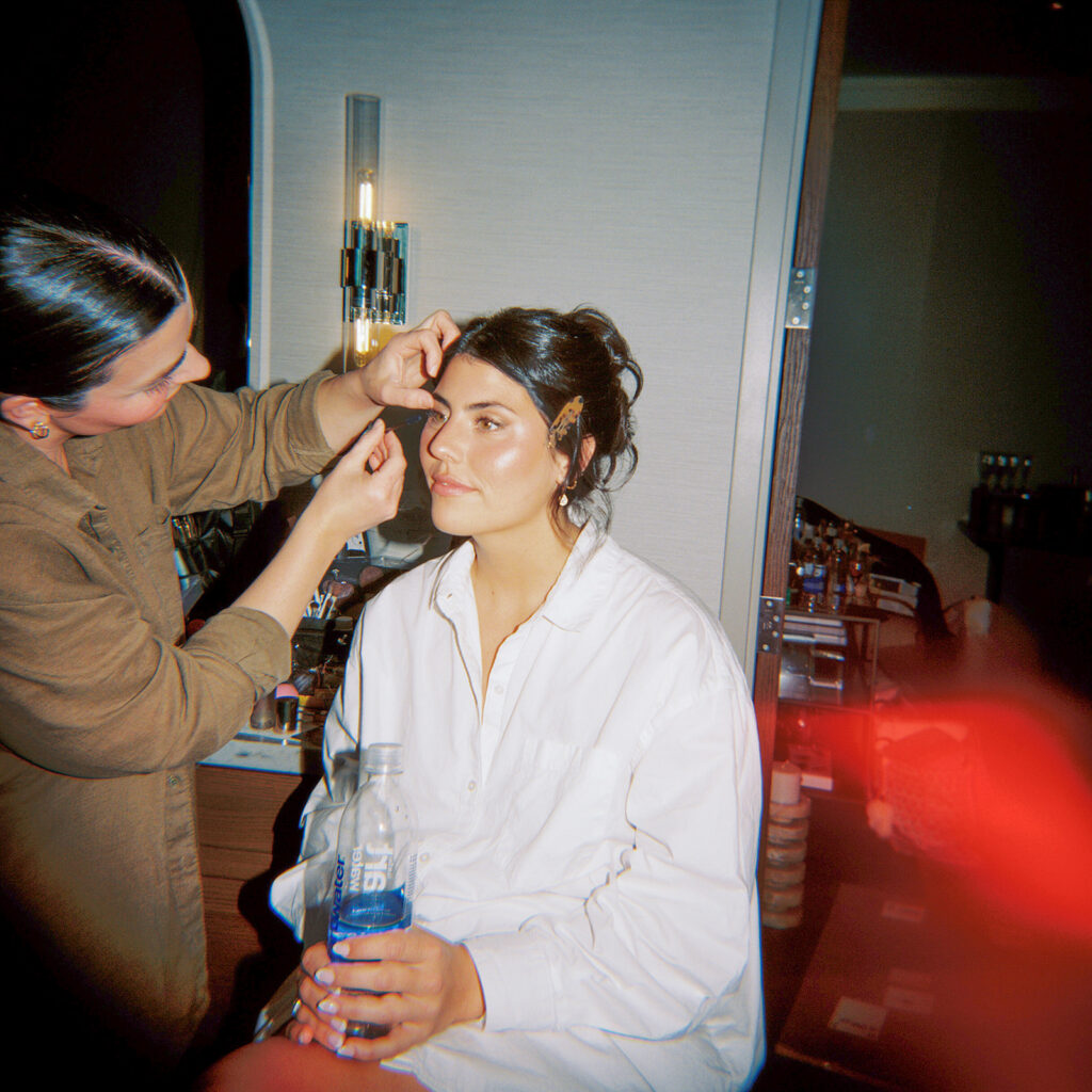 Bride getting ready with her bridesmaids before her Horseshoe Bay Resort wedding overlooking Lake LBJ in Texas.