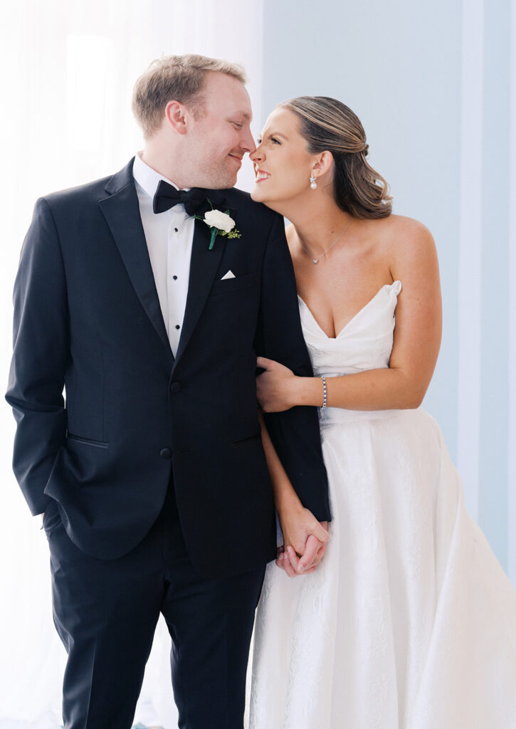 Bride and groom sharing romantic wedding portraits at the Grand Galvez in Galveston, Texas with historic architecture and coastal views.