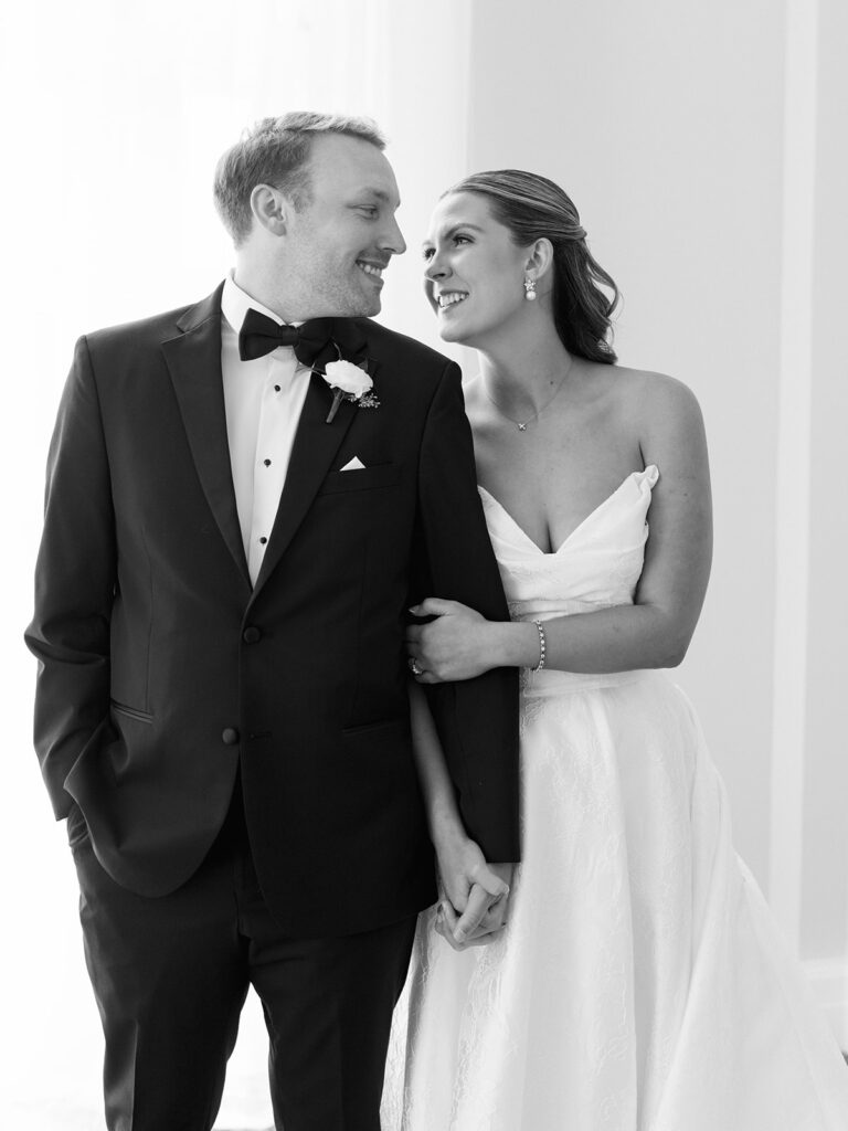 Bride and groom sharing romantic wedding portraits at the Grand Galvez in Galveston, Texas with historic architecture and coastal views.