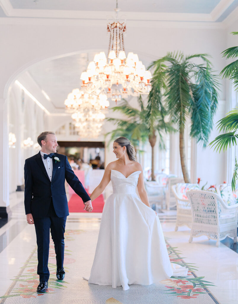 Bride and groom sharing romantic wedding portraits at the Grand Galvez in Galveston, Texas with historic architecture and coastal views.