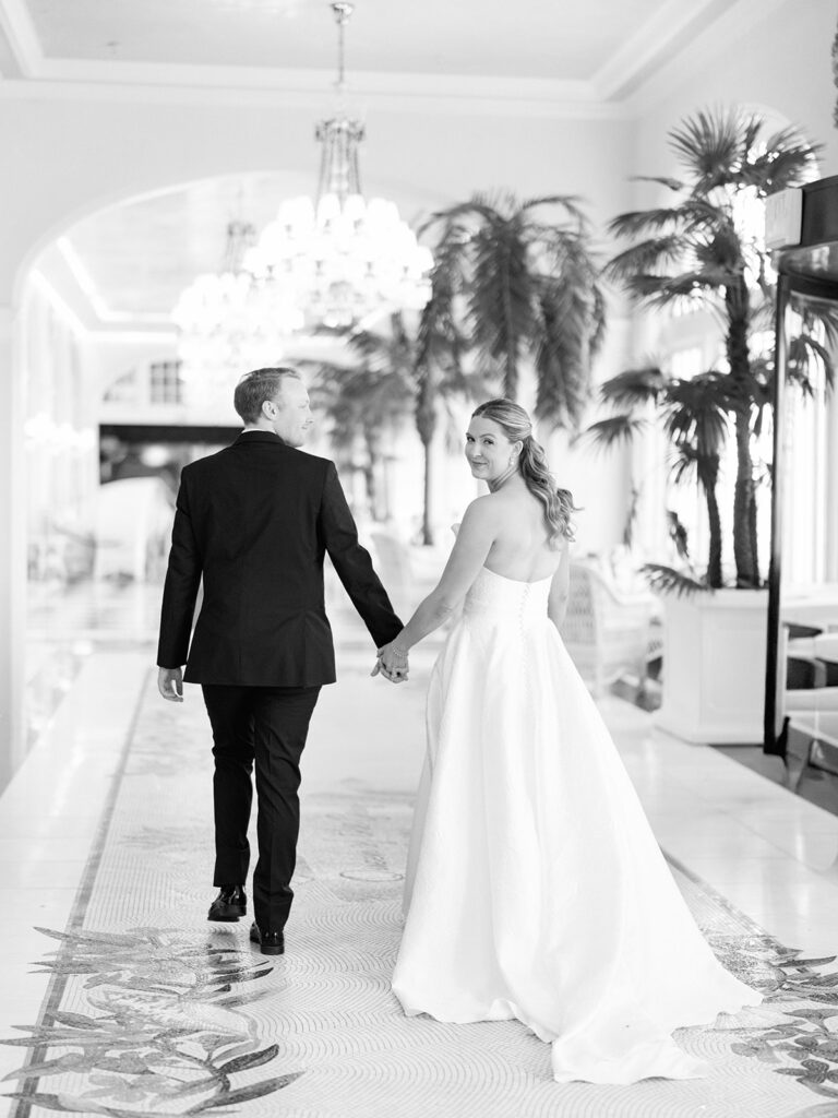 Bride and groom sharing romantic wedding portraits at the Grand Galvez in Galveston, Texas with historic architecture and coastal views.