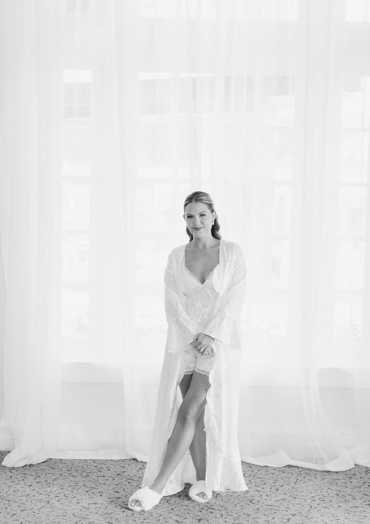 Bride getting ready with her bridesmaids before her elegant wedding at the Grand Galvez in Galveston, Texas.