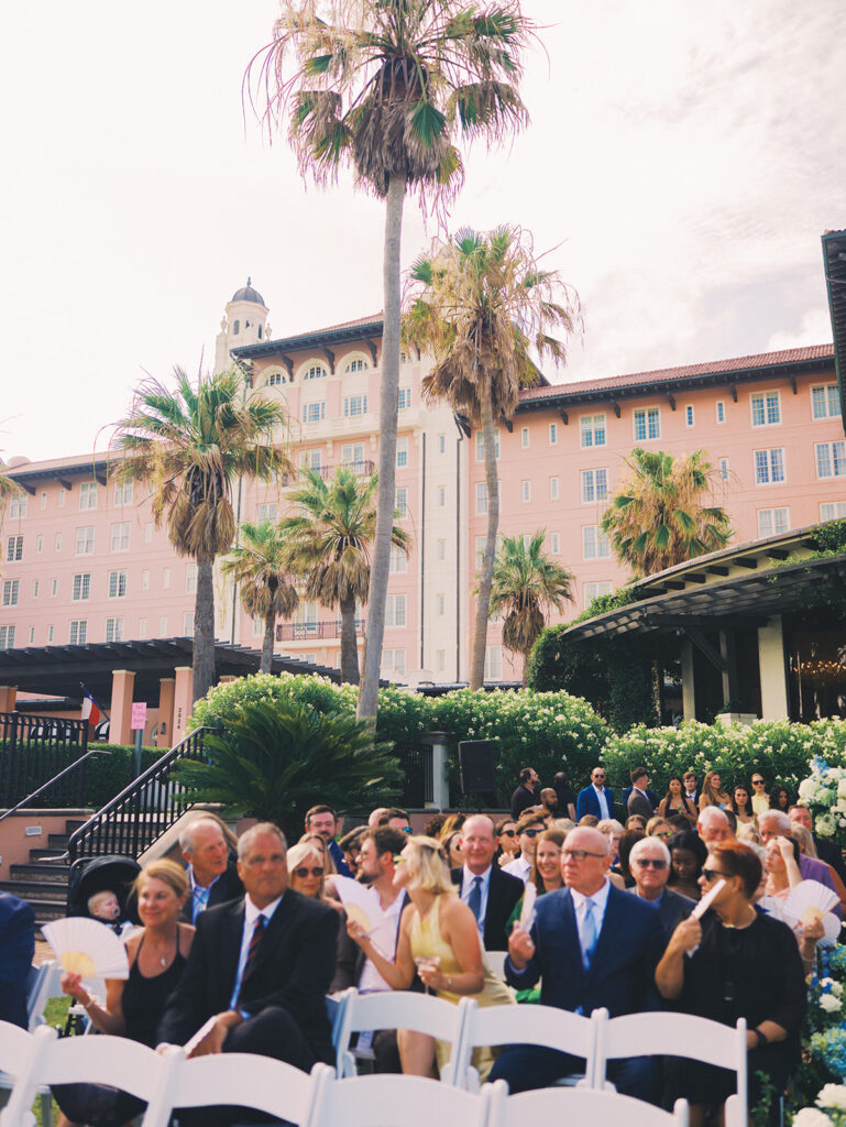 Bride and groom exchanging vows during a beautiful wedding ceremony at the Grand Galvez in Galveston, Texas.