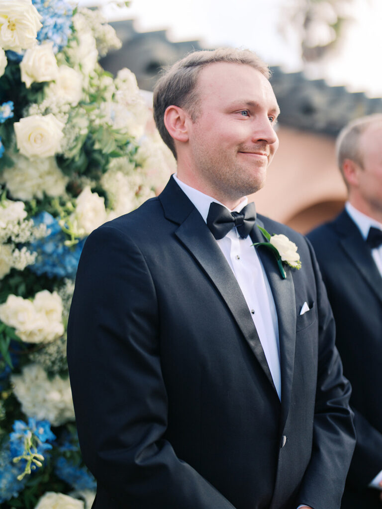 Bride and groom exchanging vows during a beautiful wedding ceremony at the Grand Galvez in Galveston, Texas.