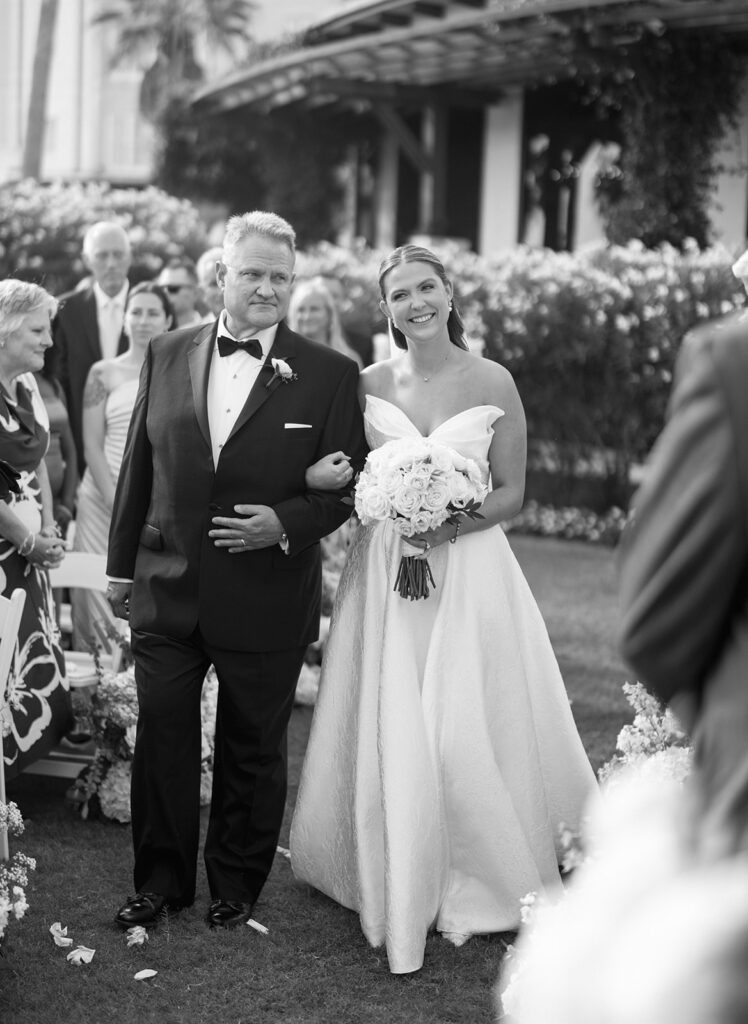 Bride and groom exchanging vows during a beautiful wedding ceremony at the Grand Galvez in Galveston, Texas.