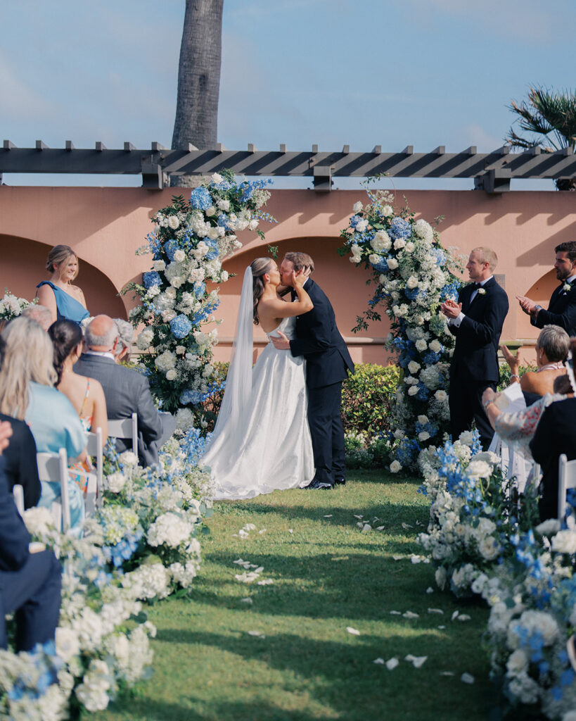 Bride and groom exchanging vows during a beautiful wedding ceremony at the Grand Galvez in Galveston, Texas.