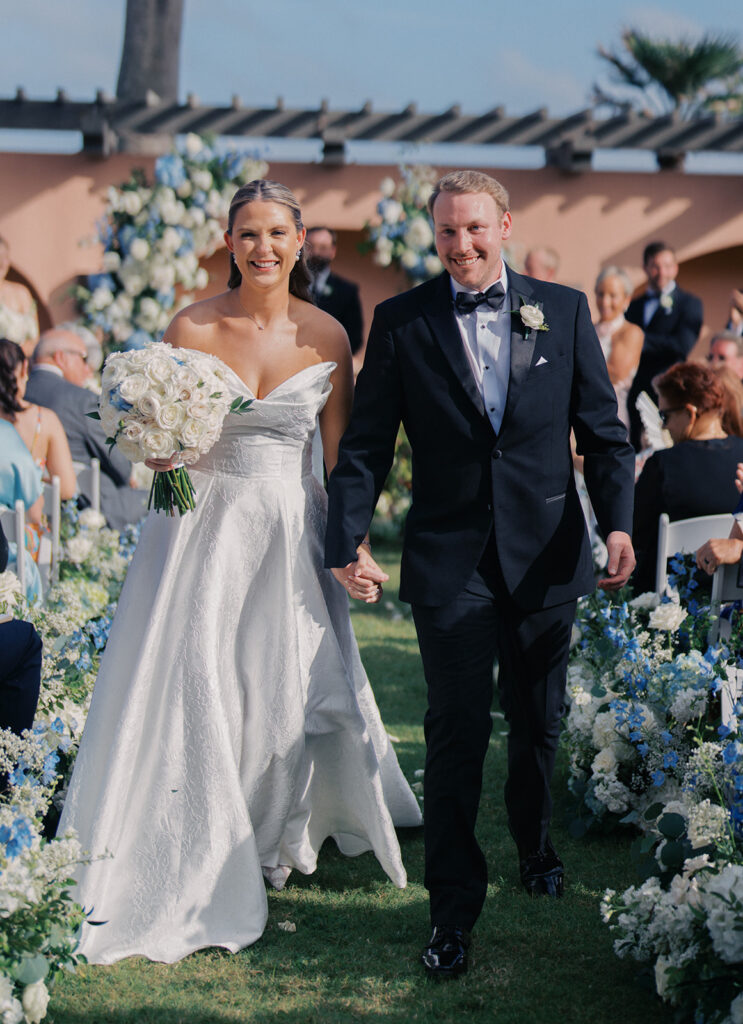 Bride and groom exchanging vows during a beautiful wedding ceremony at the Grand Galvez in Galveston, Texas.