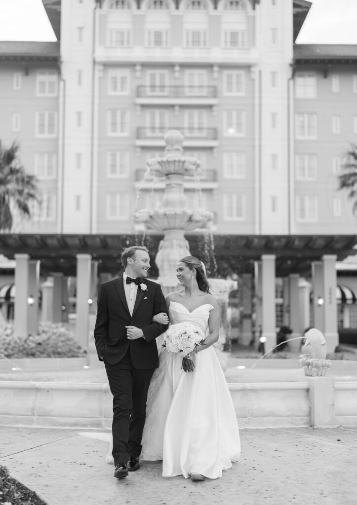 Bride and groom sharing romantic wedding portraits at the Grand Galvez in Galveston, Texas with historic architecture and coastal views.