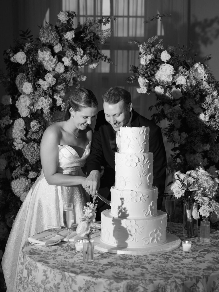 Elegant wedding reception at the Grand Galvez in Galveston, Texas featuring lush florals, soft blue details, and joyful celebration