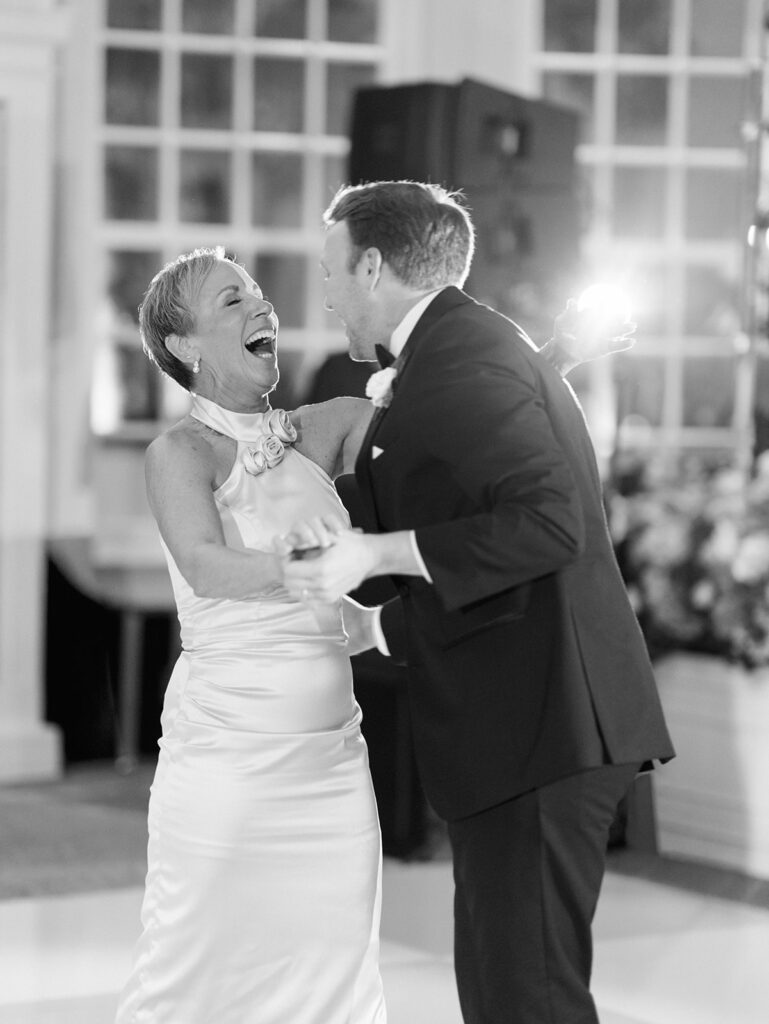 Elegant wedding reception at the Grand Galvez in Galveston, Texas featuring lush florals, soft blue details, and joyful celebration