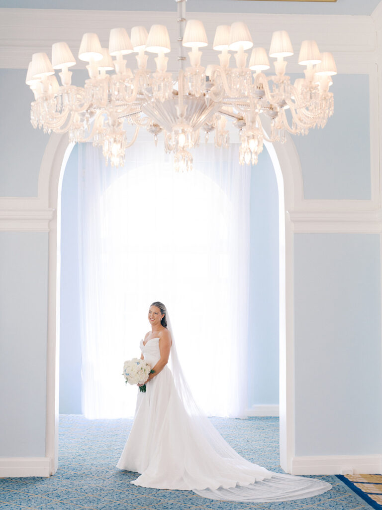 Bride getting ready with her bridesmaids before her elegant wedding at the Grand Galvez in Galveston, Texas.